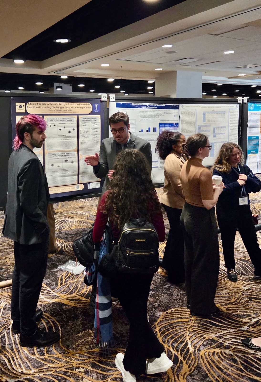 Peter Wasiuk discussing lab research at a scientific poster session